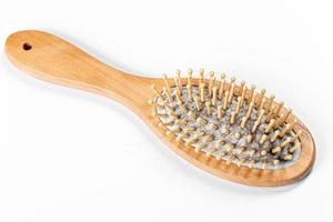 Concept women hair loss problems. Many hair fall out, attached to a hair brush photo