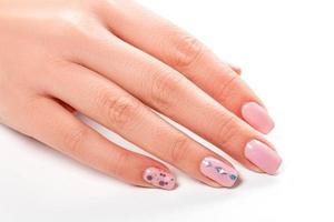 Female hand with pink manicure