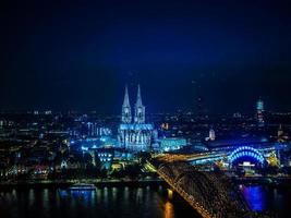 HDR Aerial night view of St Peter Cathedral and Hohenzollern Bri photo