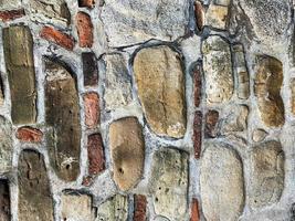 antiguo fondo de pared de piedra. telón de fondo de piedra foto