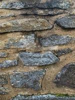 antiguo fondo de pared de piedra. telón de fondo de piedra foto