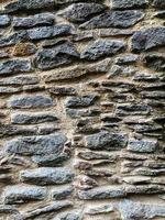 Old stone wall background. Stone backdrop photo