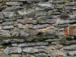 Old stone wall background. Stone backdrop photo