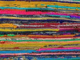 Colored textile carpet background. Carpet texture photo