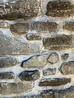 antiguo fondo de pared de piedra. telón de fondo de piedra foto