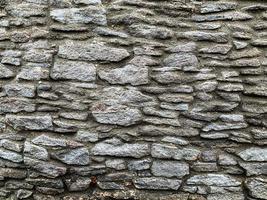 antiguo fondo de pared de piedra. telón de fondo de piedra foto