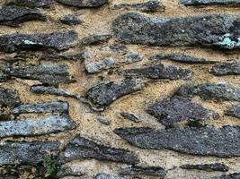 Old stone wall background. Stone backdrop photo