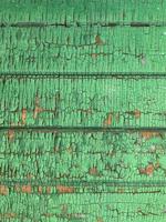 Wooden wall with weathered paint texture photo