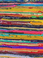 Colored textile carpet background. Carpet texture photo