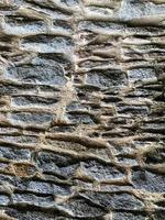 Old stone wall background. Stone backdrop photo