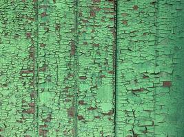 Wooden wall with weathered paint texture photo