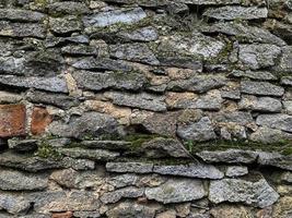 Old stone wall background. Stone backdrop photo