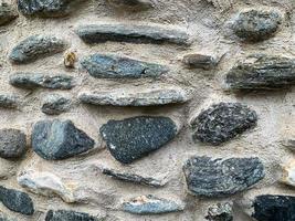 antiguo fondo de pared de piedra. telón de fondo de piedra foto