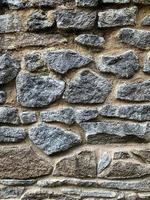 antiguo fondo de pared de piedra. telón de fondo de piedra foto