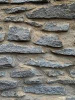 Old stone wall background. Stone backdrop photo