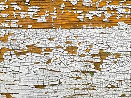 Wooden wall with weathered paint texture photo