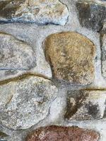 antiguo fondo de pared de piedra. telón de fondo de piedra foto