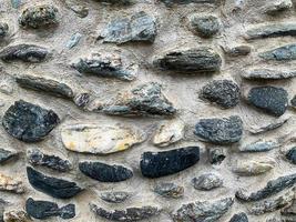 antiguo fondo de pared de piedra. telón de fondo de piedra foto