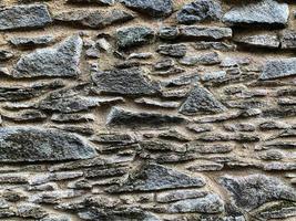 Old stone wall background. Stone backdrop photo