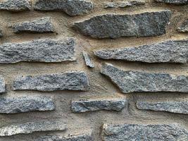 Old stone wall background. Stone backdrop photo