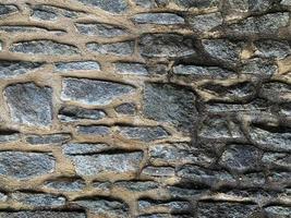 Old stone wall background. Stone backdrop photo