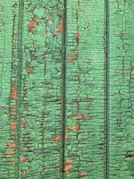 Wooden wall with weathered paint texture photo