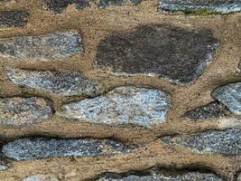 Old stone wall background. Stone backdrop photo