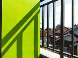 a shadow photo of the iron fence on the second floor