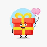 lindo personaje de caja de regalo con globo vector