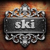 ski word of iron on wooden background photo