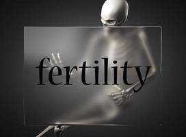 fertility word on glass and skeleton photo