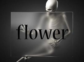 flower word on glass and skeleton photo