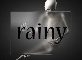 rainy word on glass and skeleton photo