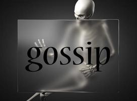 gossip word on glass and skeleton photo