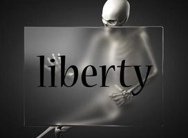 liberty word on glass and skeleton photo