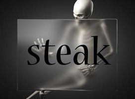 steak word on glass and skeleton photo