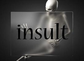 insult word on glass and skeleton photo