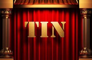 tin golden word on red curtain photo