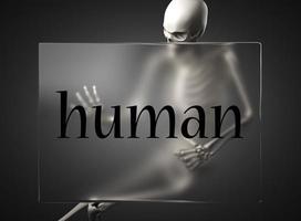 human word on glass and skeleton photo