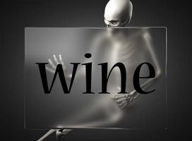 palabra de vino en vidrio y esqueleto foto
