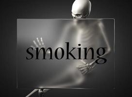 smoking word on glass and skeleton photo