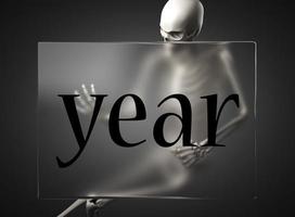 year word on glass and skeleton photo