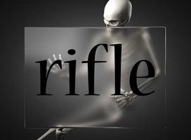 rifle word on glass and skeleton photo