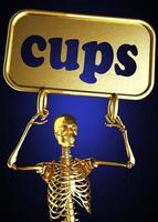 cups word and golden skeleton photo