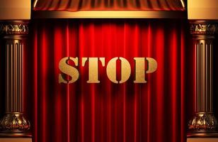 stop golden word on red curtain photo