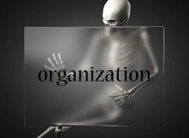 palabra de organización sobre vidrio y esqueleto foto