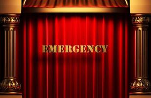 palabra dorada de emergencia en cortina roja foto