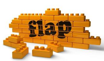 flap word on yellow brick wall photo