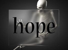 hope word on glass and skeleton photo