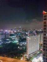 City panorama Bangkok by night. Skyscraper cityscape capital of Thailand. photo